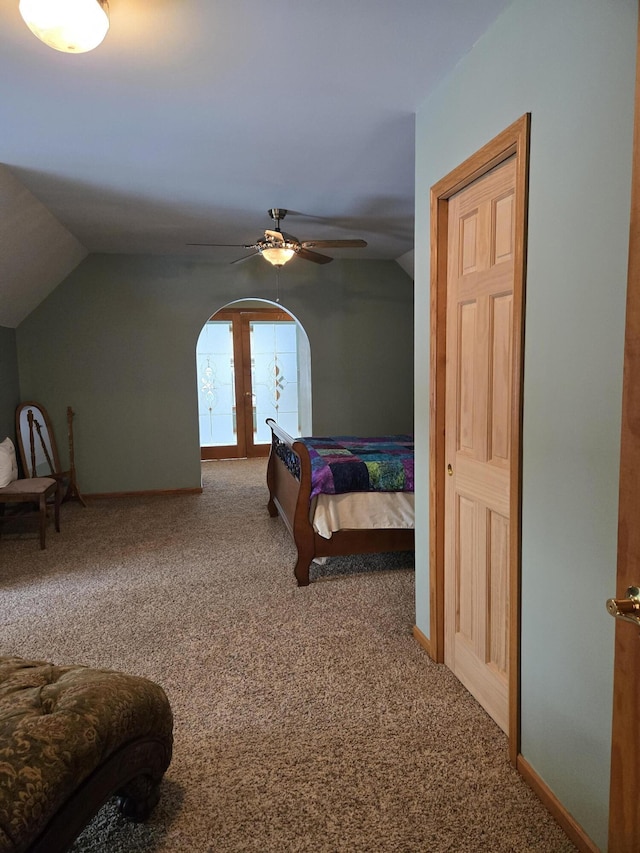 bedroom featuring vaulted ceiling, ceiling fan, carpet flooring, and french doors