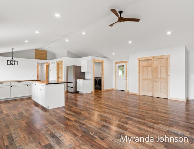 kitchen with pendant lighting, white cabinets, dark hardwood / wood-style floors, stainless steel refrigerator, and ceiling fan