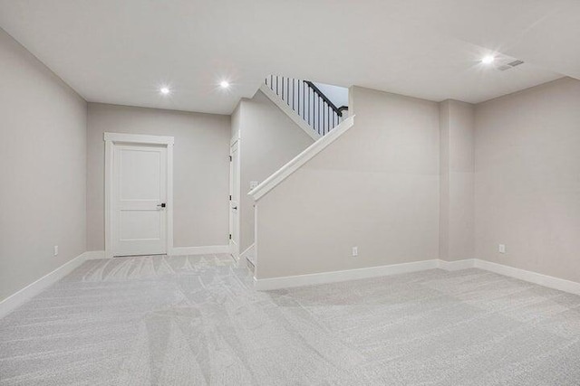 basement with light colored carpet