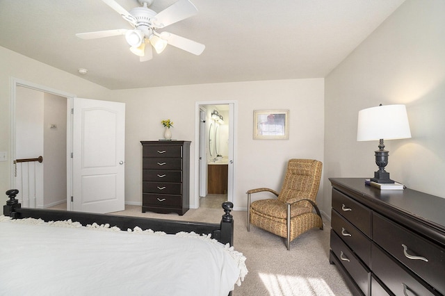 carpeted bedroom featuring ensuite bath and ceiling fan