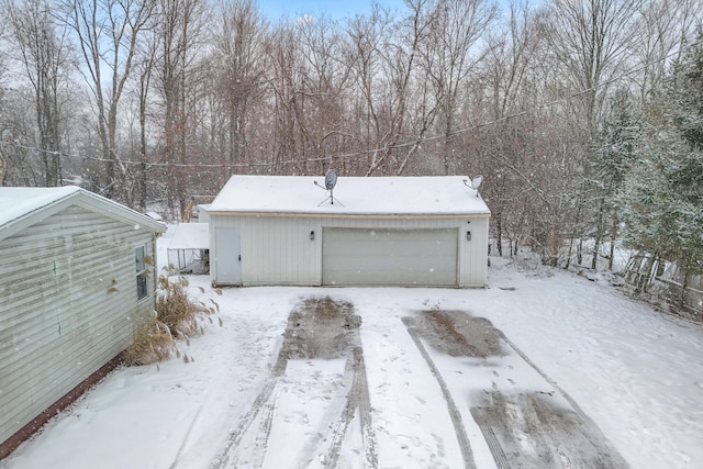 view of snow covered garage