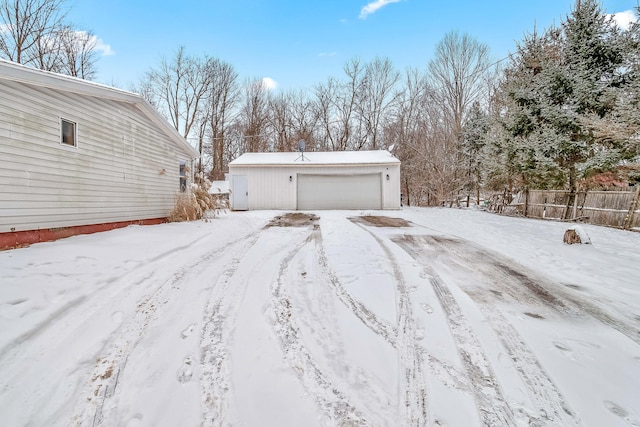 exterior space featuring a garage and an outbuilding