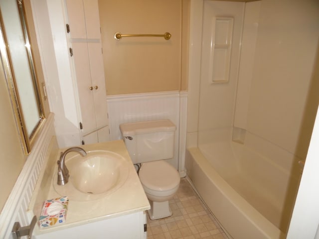 full bathroom with  shower combination, vanity, and toilet