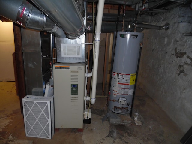 utility room featuring gas water heater