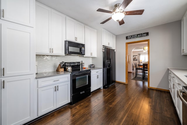 kitchen featuring white cabinetry, backsplash, dark hardwood / wood-style flooring, and black appliances