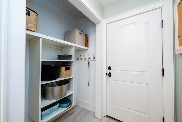 mudroom with light hardwood / wood-style floors