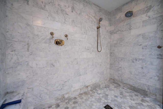 bathroom featuring tiled shower