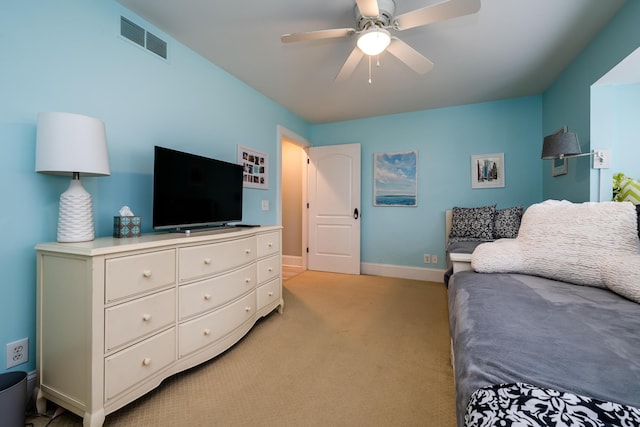 bedroom featuring ceiling fan and light colored carpet