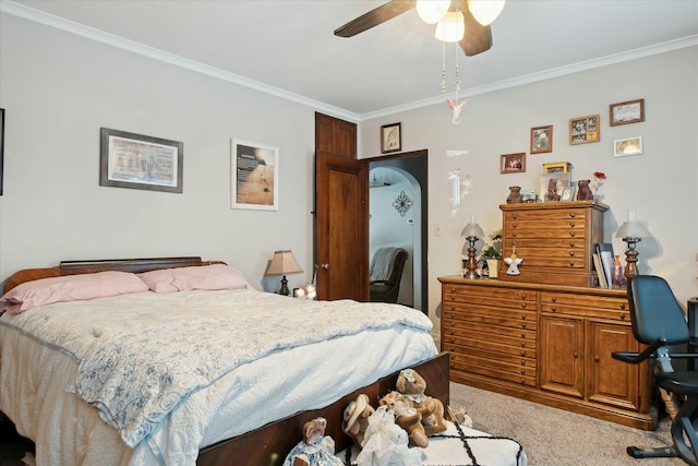 bedroom featuring ceiling fan, light carpet, and ornamental molding