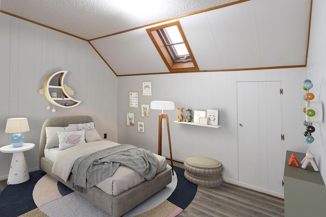 bedroom featuring hardwood / wood-style flooring and lofted ceiling with skylight