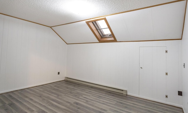 bonus room with lofted ceiling, hardwood / wood-style floors, a textured ceiling, and a baseboard radiator