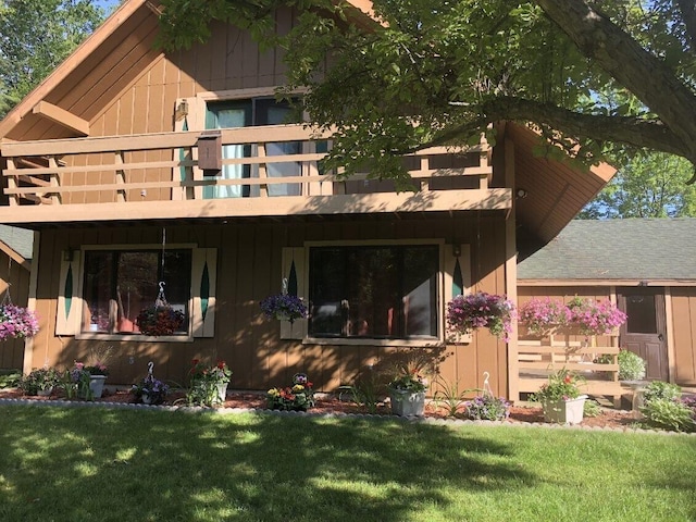 rear view of house with a yard