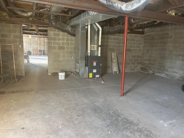 basement featuring heating unit