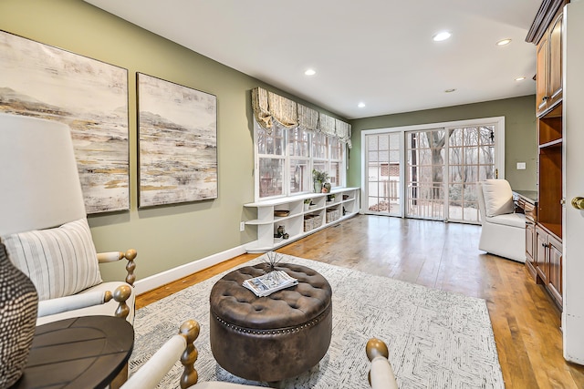 living area with light hardwood / wood-style floors