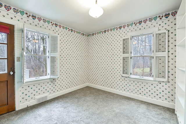 empty room with carpet flooring