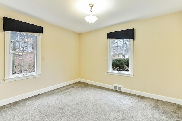 spare room featuring carpet flooring