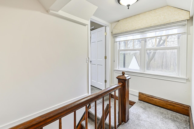 corridor featuring vaulted ceiling