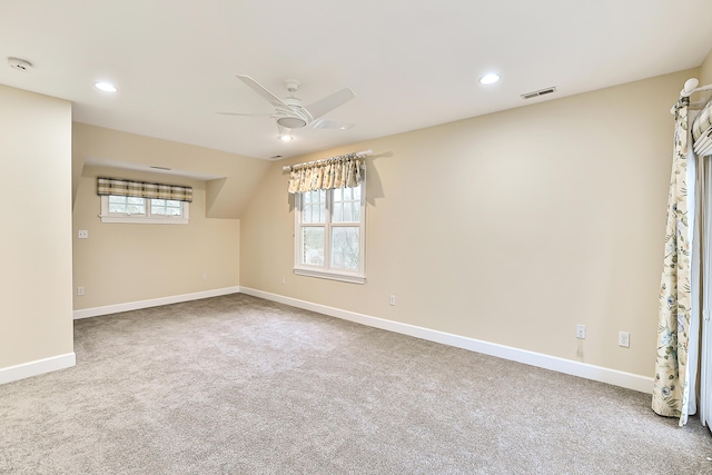 empty room with ceiling fan and carpet flooring