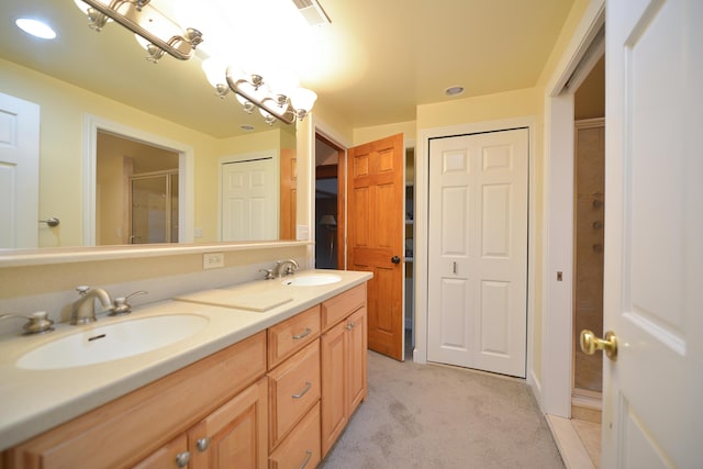 bathroom featuring vanity and a shower with shower door