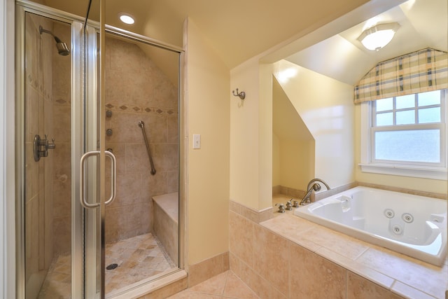 bathroom featuring tile patterned floors, independent shower and bath, and vaulted ceiling