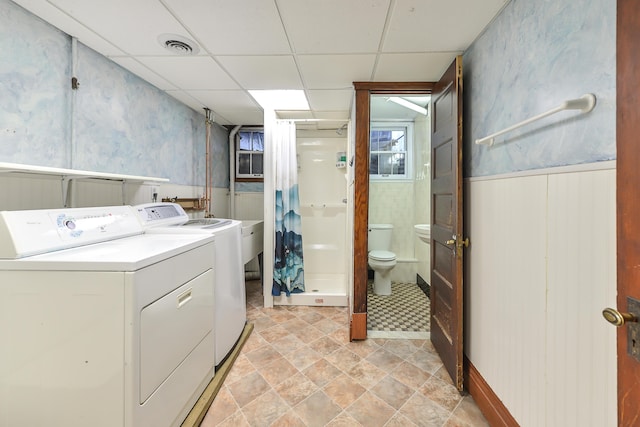 laundry area with washing machine and clothes dryer