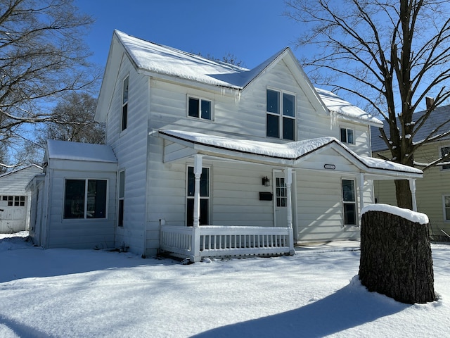 view of front facade with a garage and covered porch