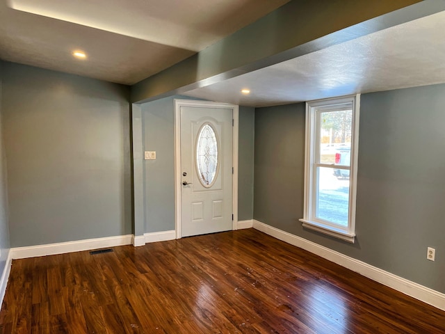 foyer featuring dark wood-type flooring