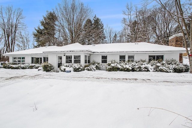 view of snow covered house