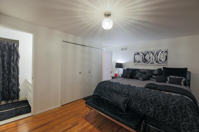 bedroom featuring wood-type flooring