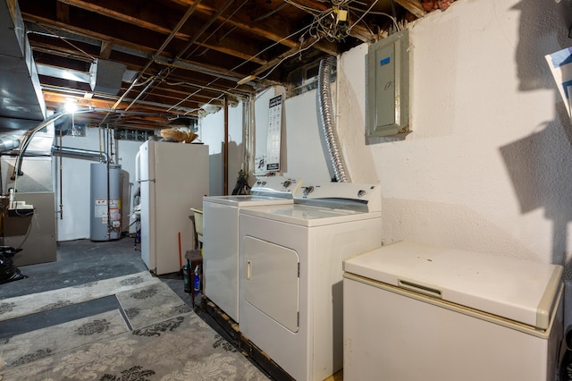 laundry room featuring electric panel, washer and clothes dryer, heating unit, and gas water heater