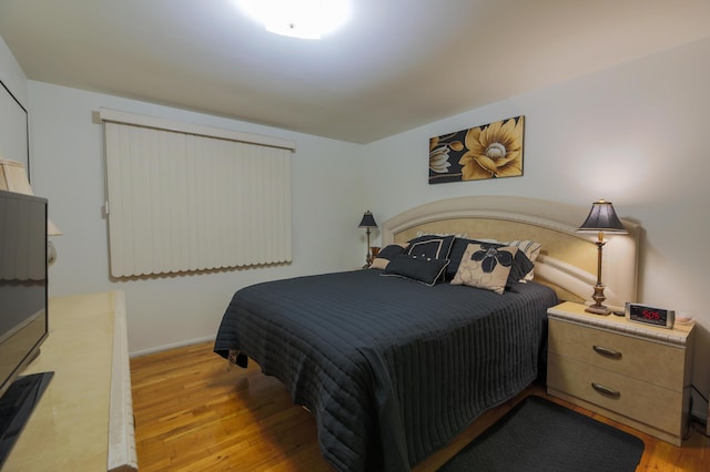 bedroom with light wood-type flooring