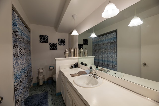 bathroom with vanity, tile patterned flooring, toilet, and a shower with curtain