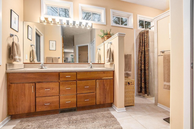 bathroom with tile patterned floors, vanity, and a shower with shower curtain