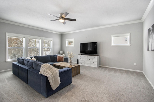 living room featuring plenty of natural light, ornamental molding, and carpet