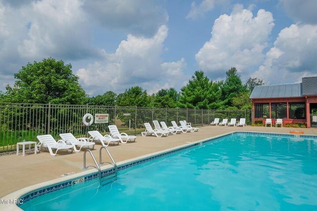 view of swimming pool featuring a patio