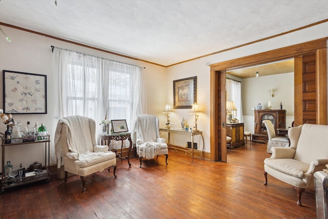 living area with hardwood / wood-style floors