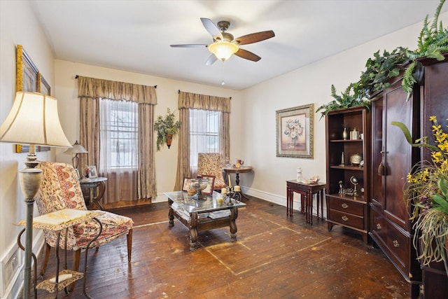 sitting room featuring ceiling fan and dark wood-type flooring