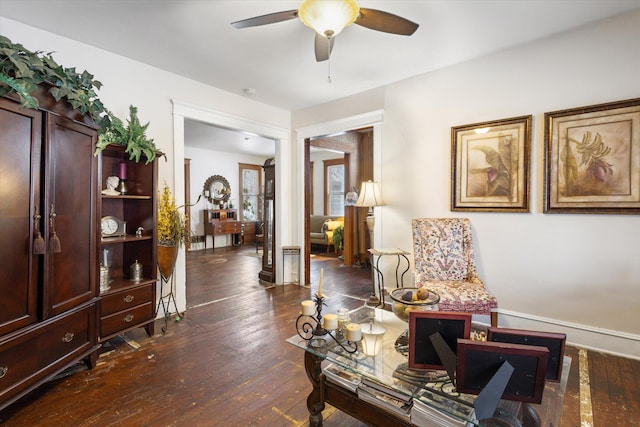 sitting room featuring ceiling fan and dark hardwood / wood-style flooring