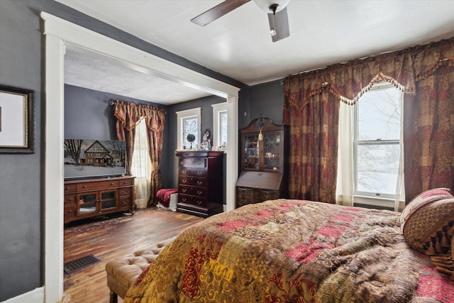 bedroom featuring ceiling fan and hardwood / wood-style floors