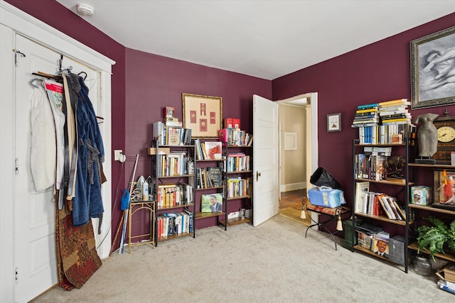 interior space featuring light carpet