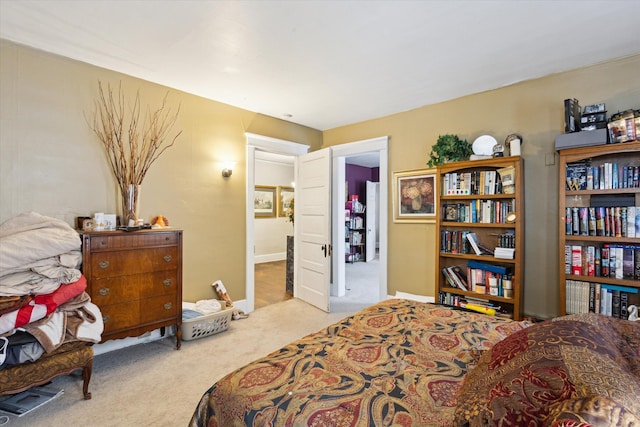 bedroom featuring light colored carpet