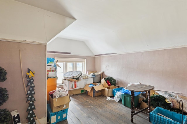 additional living space with lofted ceiling and dark hardwood / wood-style flooring