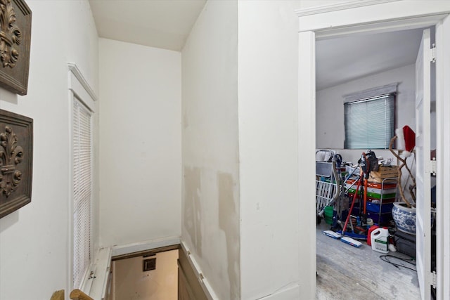 hallway with light hardwood / wood-style floors