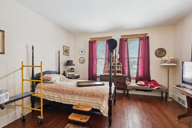 bedroom featuring dark hardwood / wood-style flooring