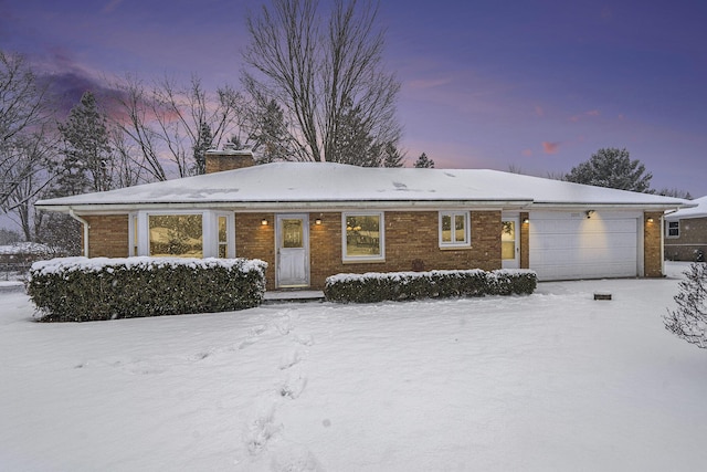 single story home with a garage