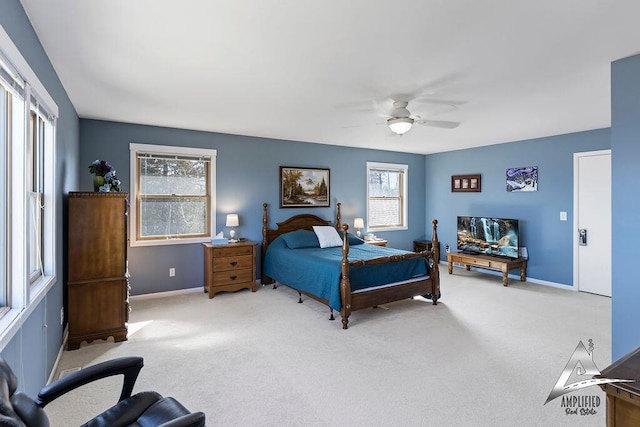 bedroom featuring ceiling fan and carpet