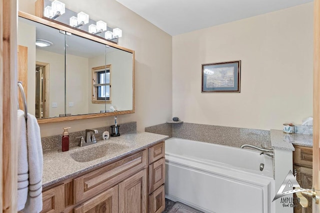 bathroom with a bathing tub and vanity