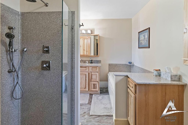 bathroom with vanity and a tile shower