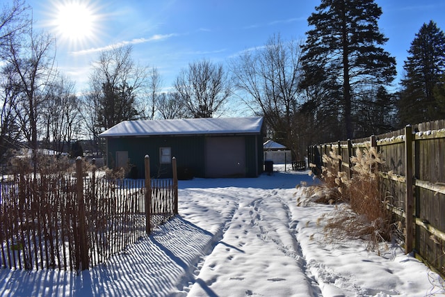 exterior space featuring an outdoor structure and a garage