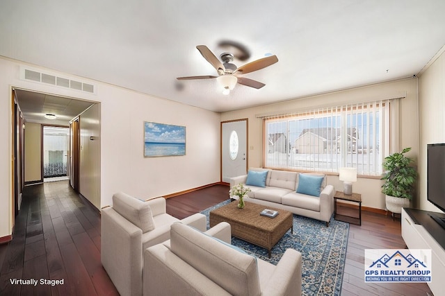 living room featuring ceiling fan and dark hardwood / wood-style floors